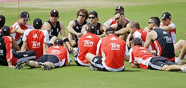 England team members sit in a group before a practice session in Hyderabad on Thursday