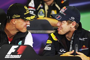 Sebastian Vettel (right) and Michael Schumacher