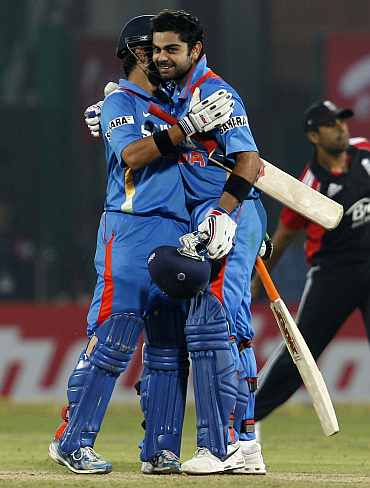 Gautam Gambhir and Virat Kohli celebrates after winning the match