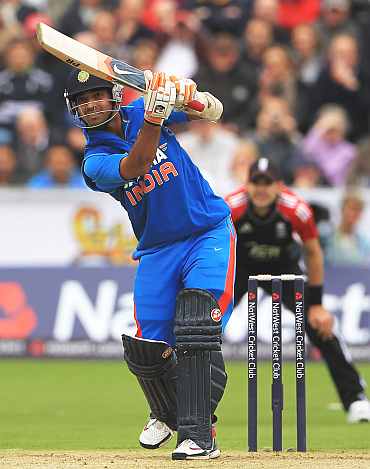 Ajinkya Rahane of India hits the ball towards the boundary