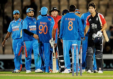 England captain Alastair Cook (right) meets India players after the match