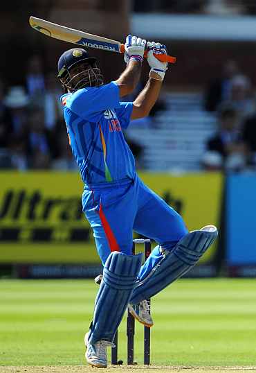 MS Dhoni hits a six during his knock against England