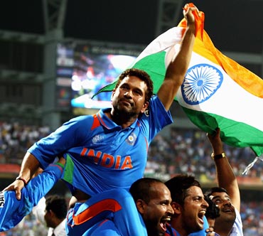 Sachin Tendulkar celebrates with team-mates after winning the 2011 World Cup