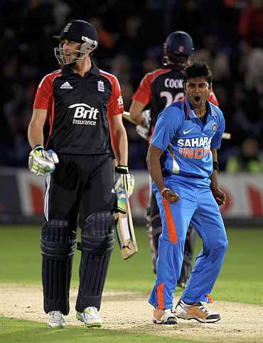 Vinay Kumar celebrates after picking up the wicket of Craig Kieswetter
