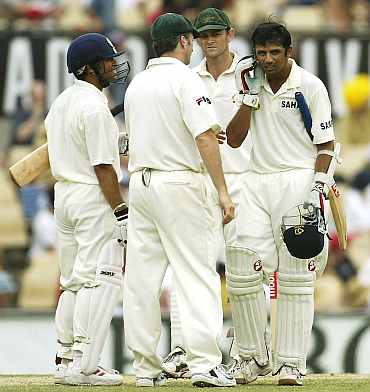 Rahul Dravid reacts after being hit by a Brett Lee delivery