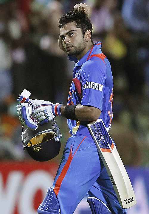 India's Virat Kohli reacts as he walks off the field after his dismissal during the Twenty20 match against Sri Lanka