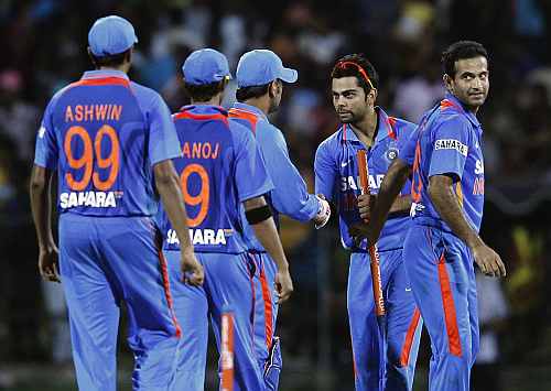 India's Virat Kohli celebrates with his teammates after winning their Twenty20 cricket match against Sri Lanka