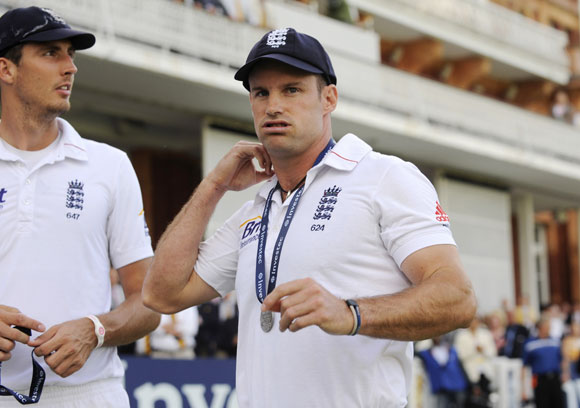 England's captain Andrew Strauss pulls a face as he stands with Steven Finn (L) after South Africa defeated England