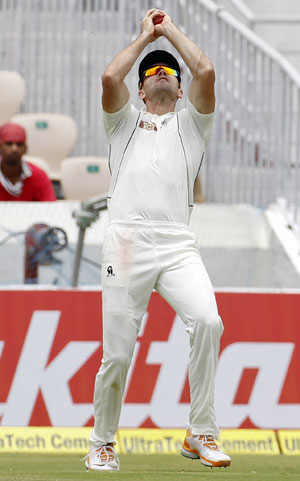New Zealand's James Franklin takes a catch off the bowling of Jeetan Patel to dismiss Cheteshwar Pujara