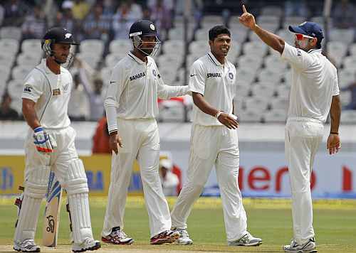 India's Virat Kohli gestures after India's Umesh Yadav took the wicket of New Zealand's Kruger Van Wyk