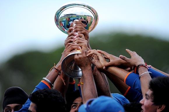 The Indian players celebrate with the Under-19 World Cup trophy