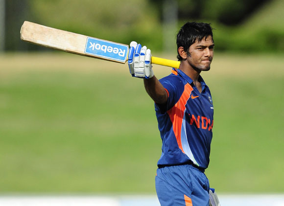 Unmukt Chand of India waves to the crowd after scoring century during the match against Australia on day five of the U19 International Quad Series at Tony Ireland Stadium on April 15, 2012