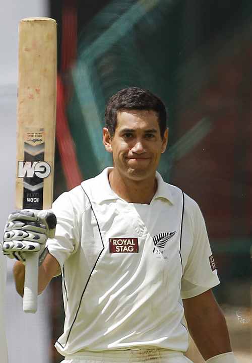 New Zealand's captain Ross Taylor reacts after scoring a century during the first day of their second Test match against India in Bangalore