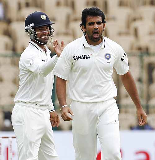 ndia's Zaheer Khan celebrates after taking the wicket of New Zealand's Brendon McCullum during the first day of their second Test match in Bangalore