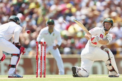 Matthew Wade of Australia is bowled by Robin Peterson of South Africa