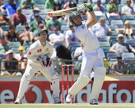 South Africa's AB de Villiers hits a six off Australia's Nathan Lyon as keeper Matthew Wade looks on at the WACA