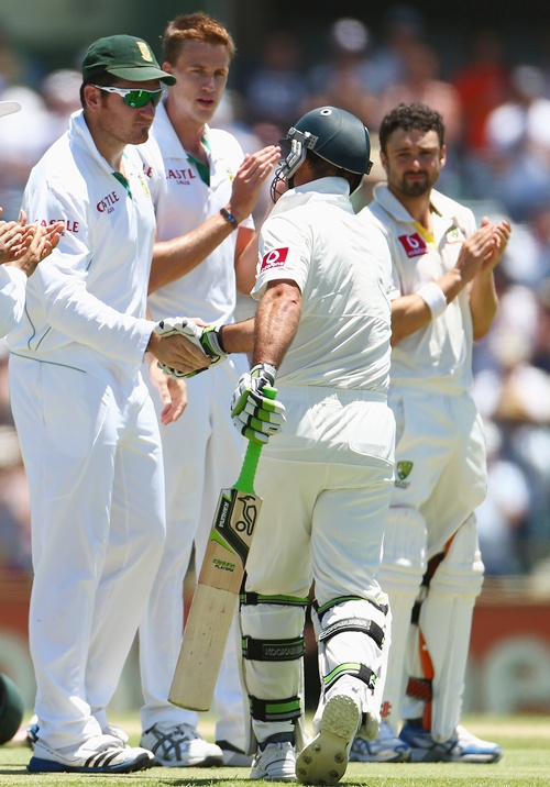 Ricky Ponting of Australia is greeting to the wicket by South African captain Graeme Smith