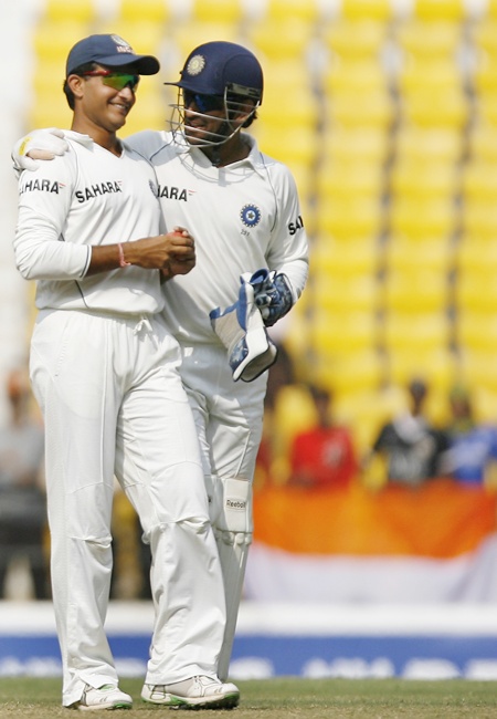 Mahendra Singh Dhoni (right) speaks with Saurav Ganguly
