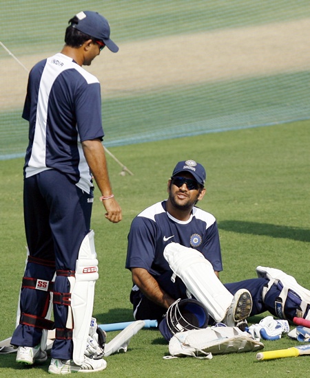India's Saurav Ganguly (left) speaks with Mahendra Singh Dhoni