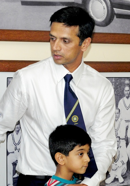 Rahul Dravid walks with his son