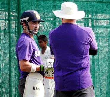 Gautam Gambhir and coach Duncan Fletcher have a word after taking a look at the wicket