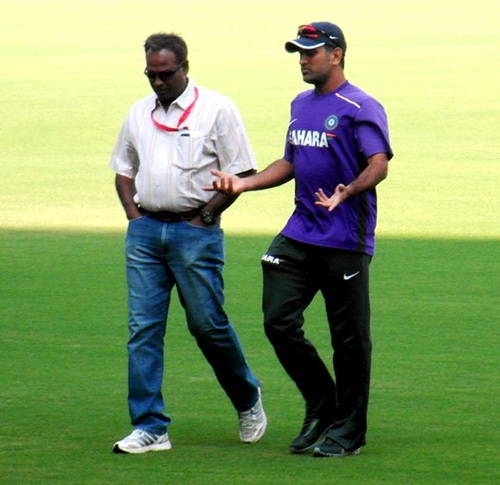 Dhoni with the ground's curator