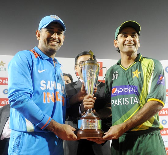 Mahendra Singh Dhoni and Mohammad Hafeez with the series trophy at the end of the match. The two-match series ended in a 1-1 draw