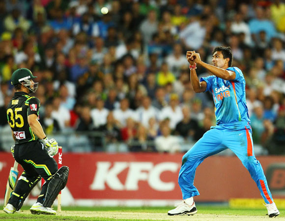 Rahul Sharma of India drops a caught and bowled chance during the International Twenty20 match between Australia and India at ANZ Stadium