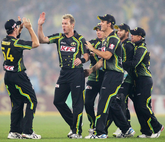 Brett Lee celebrates with teammates after taking the wicket of Virender Sehwag during the 1st Twenty20 on Wednesday