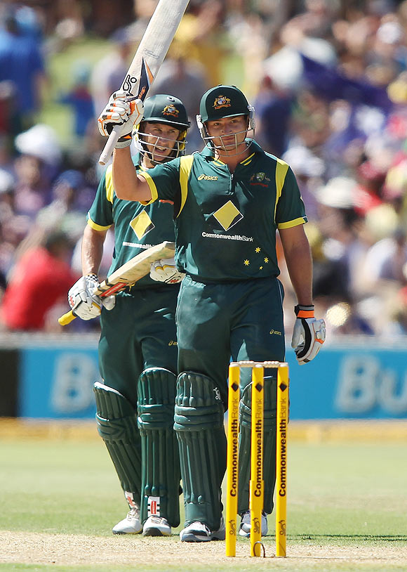 Peter Forrest (right) of Australia celebrates reaching 50 runs along with team-mate David Hussey (left)