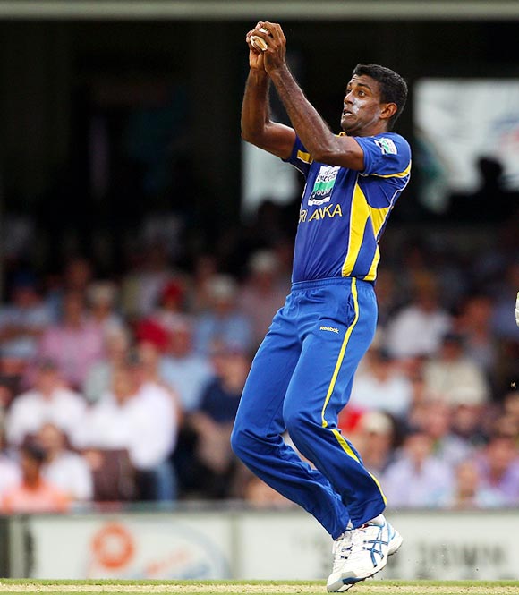 Farveez Maharoof takes a return catch to dismiss Ricky Ponting