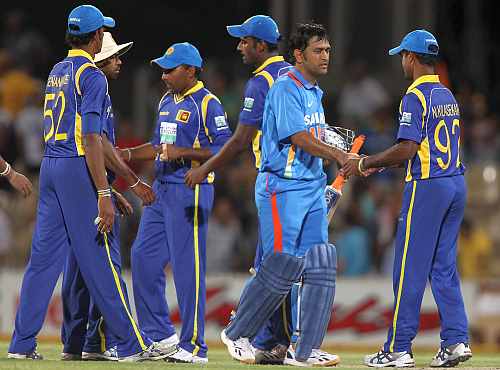 MS Dhoni shakes hands with Sri Lankan players after the match
