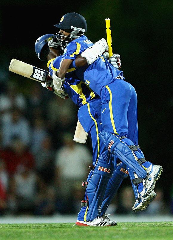 Sri Lanka's Thisara Perera and Nuwan Kulasekara celebrate after scoring the winning runs to beat Australia at Bellerive Oval on Friday