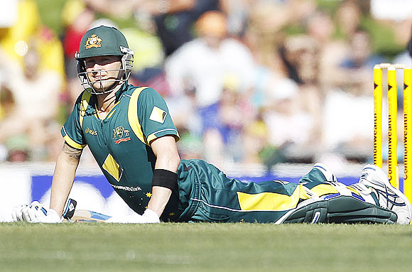 Michael Clarke stretches during the match