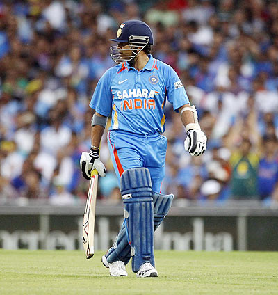 Sachin Tendulkar looks over his shoulder as he walks from the field after being run out by David Warner
