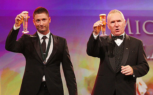 Michael Clarke (left) of Australia shares a toast with Allan Border