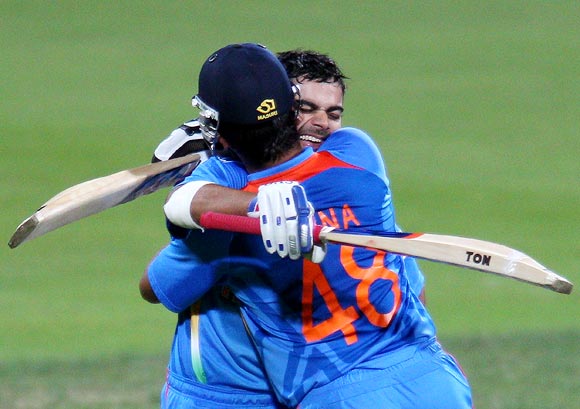 Virat Kohli celebrates with Suresh Raina after winning the Hobart ODI