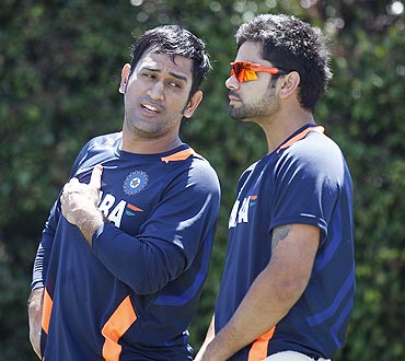 India's captain Mahendra Singh Dhoni (left) talks to teammate Virat Kohli during a nets session at the Sydney Cricket Ground on Monday