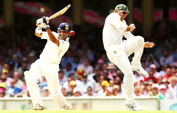 Gautam Gambhir plays a shot as Ricky Ponting takes evasive action