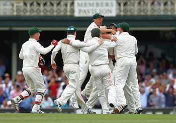 Australian players celebrate after winning the Test