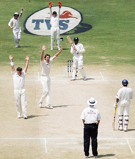 Glenn McGrath of Australia traps Virender Sehwag of India LBW during day four of the First Test between India and Australia