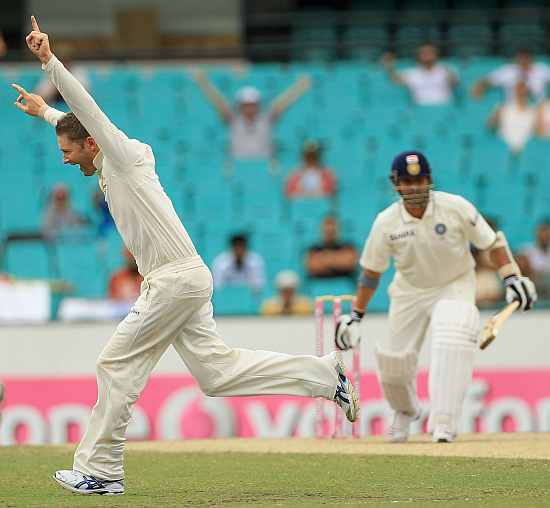 Michael Clarke celebrates after picking up a wicket of Sachin Tendulkar