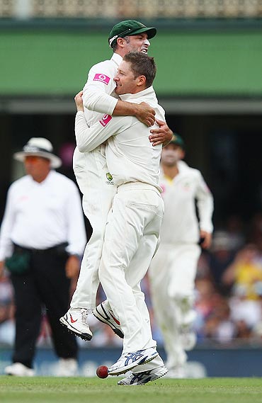 Michael Clarke and Michael Hussey celebrate