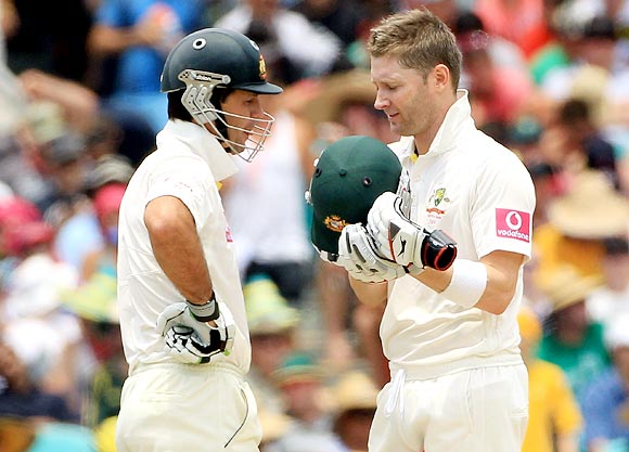 Michael Clarke (right) speaks with Ricky Ponting