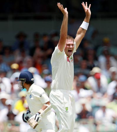 Ryan Harris celebrates after taking the wicket of Sachin Tendulkar