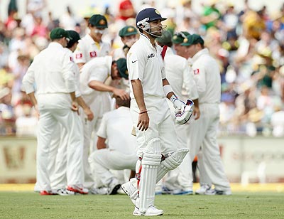Virat Kohli of India leaves the field after being dismissed by Peter Siddle
