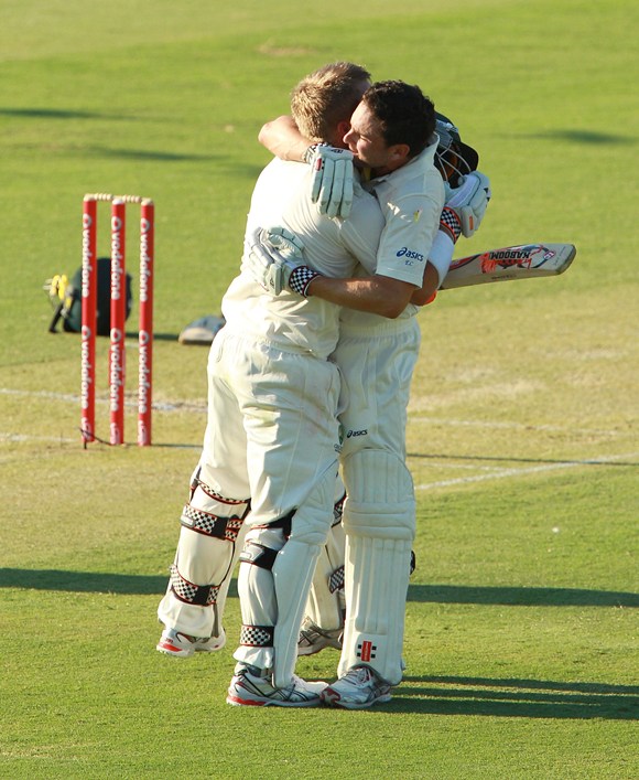 Warner is congratulated by Ed Cowan after his hundred