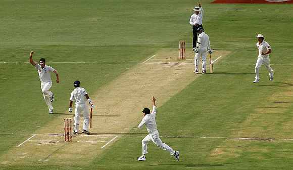 Mitchell Starc celebrates after picking the wicket of Gautam Gambhir