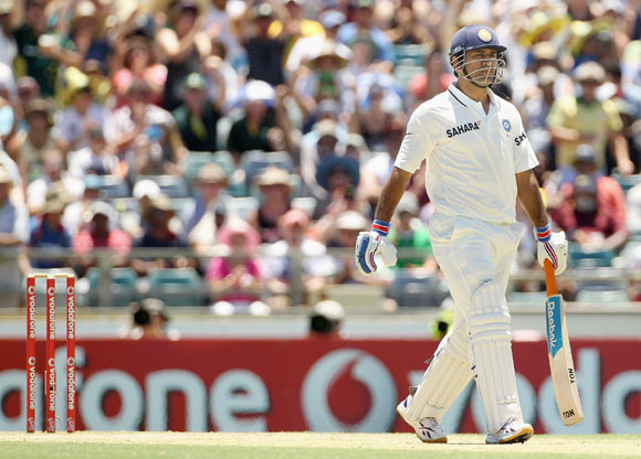 MS Dhoni of India leaves the field after being dismissed during day three of the Third Test in Perth