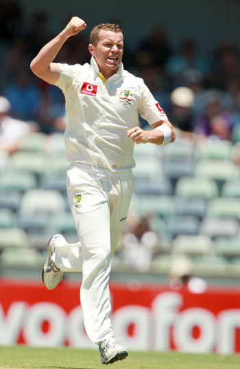 Peter Siddle of Australia celebrates dismissing MS Dhoni of India during day three of the Third Test match between Australia and India at the WACA